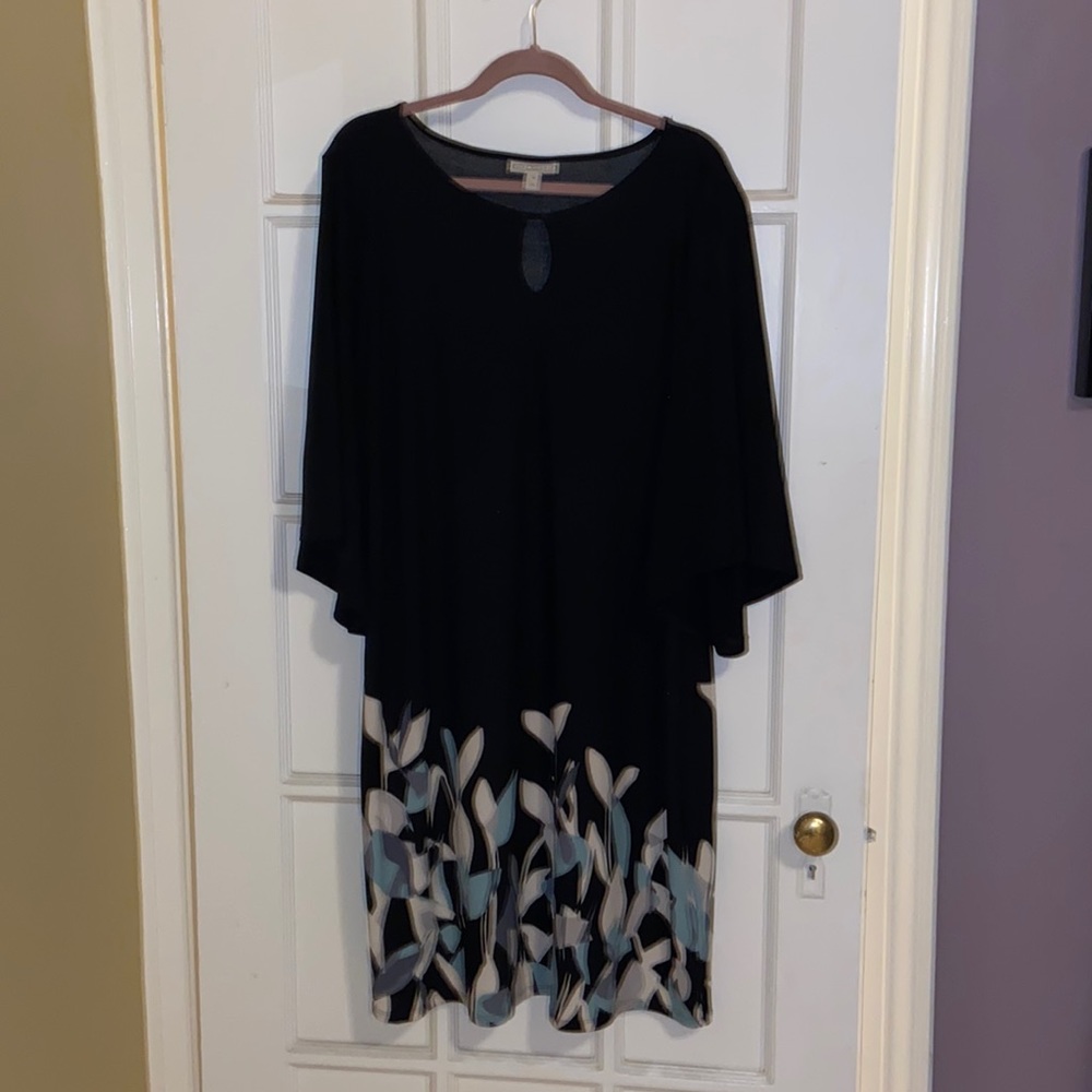 Beautiful black dress with flowers growing from the hem